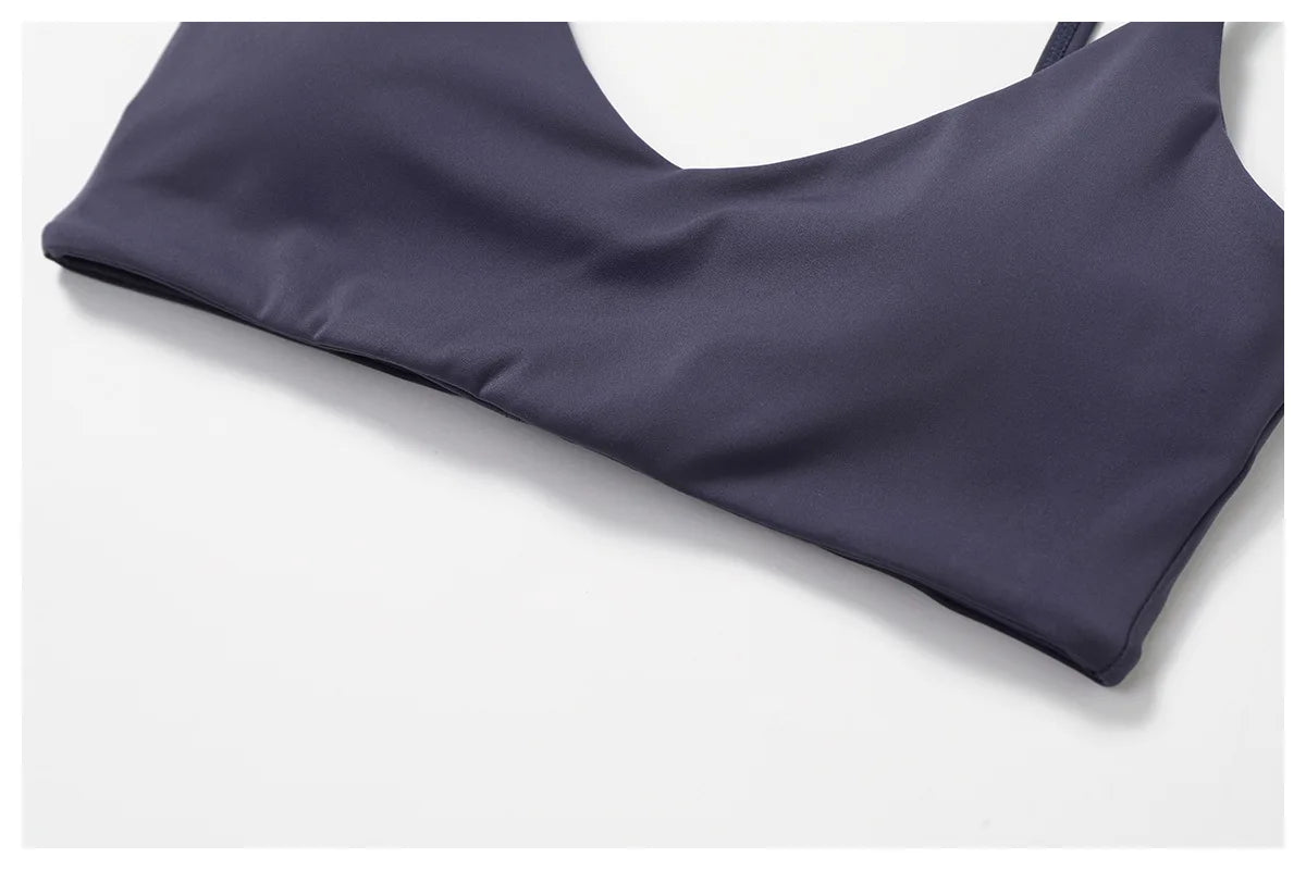 Two-piece women's fitness set including crop top, sports bra, and leggings from The Clothing Company Sydney, ideal for yoga and gym workouts.