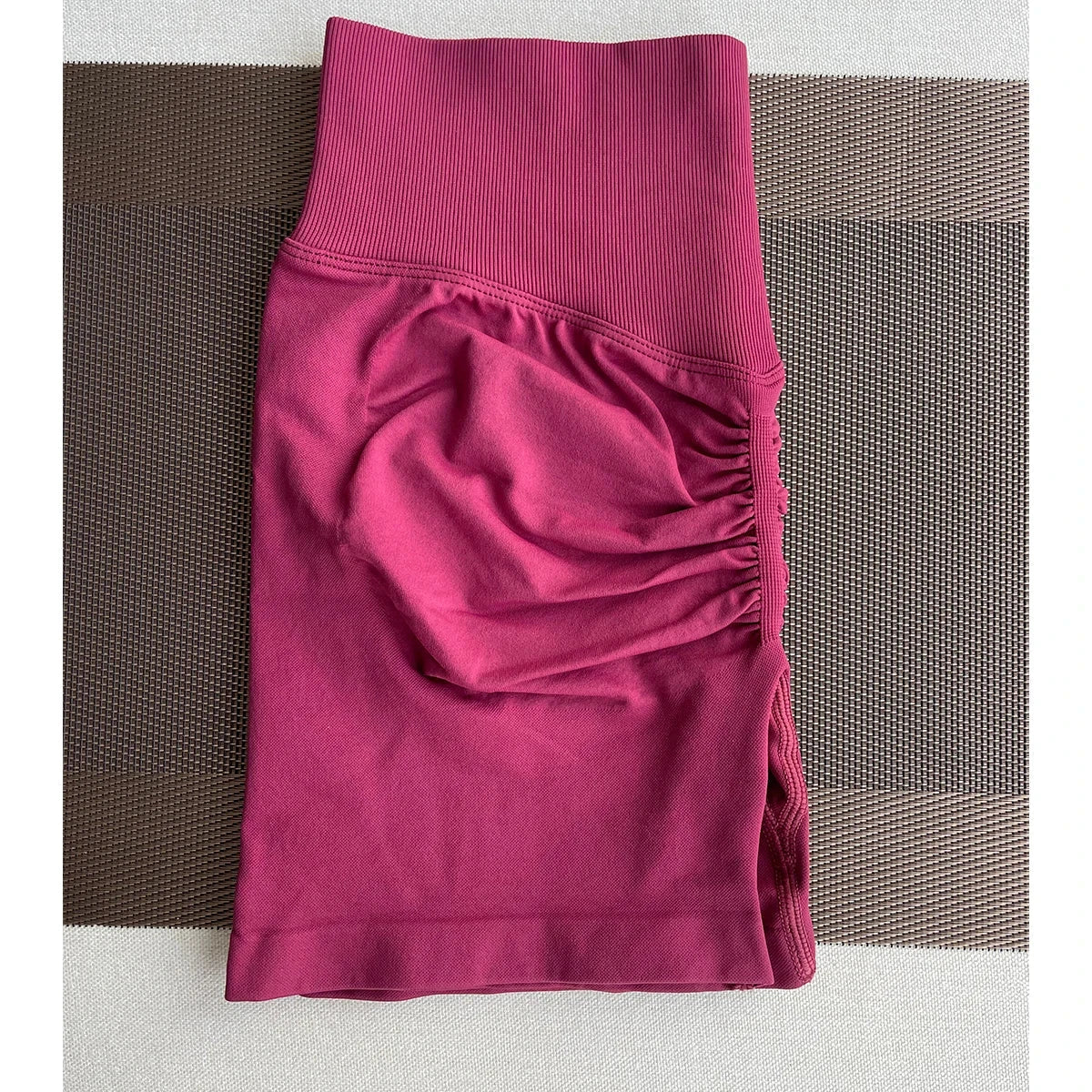 Solid seamless half pants for women, soft fitness shorts from The Clothing Company Sydney, ideal for yoga, gym, running, and cycling.