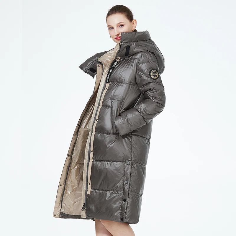 Women’s long hooded winter parka by The Clothing Company Sydney, thick quilted puffer jacket with front pockets, ideal for cold weather.