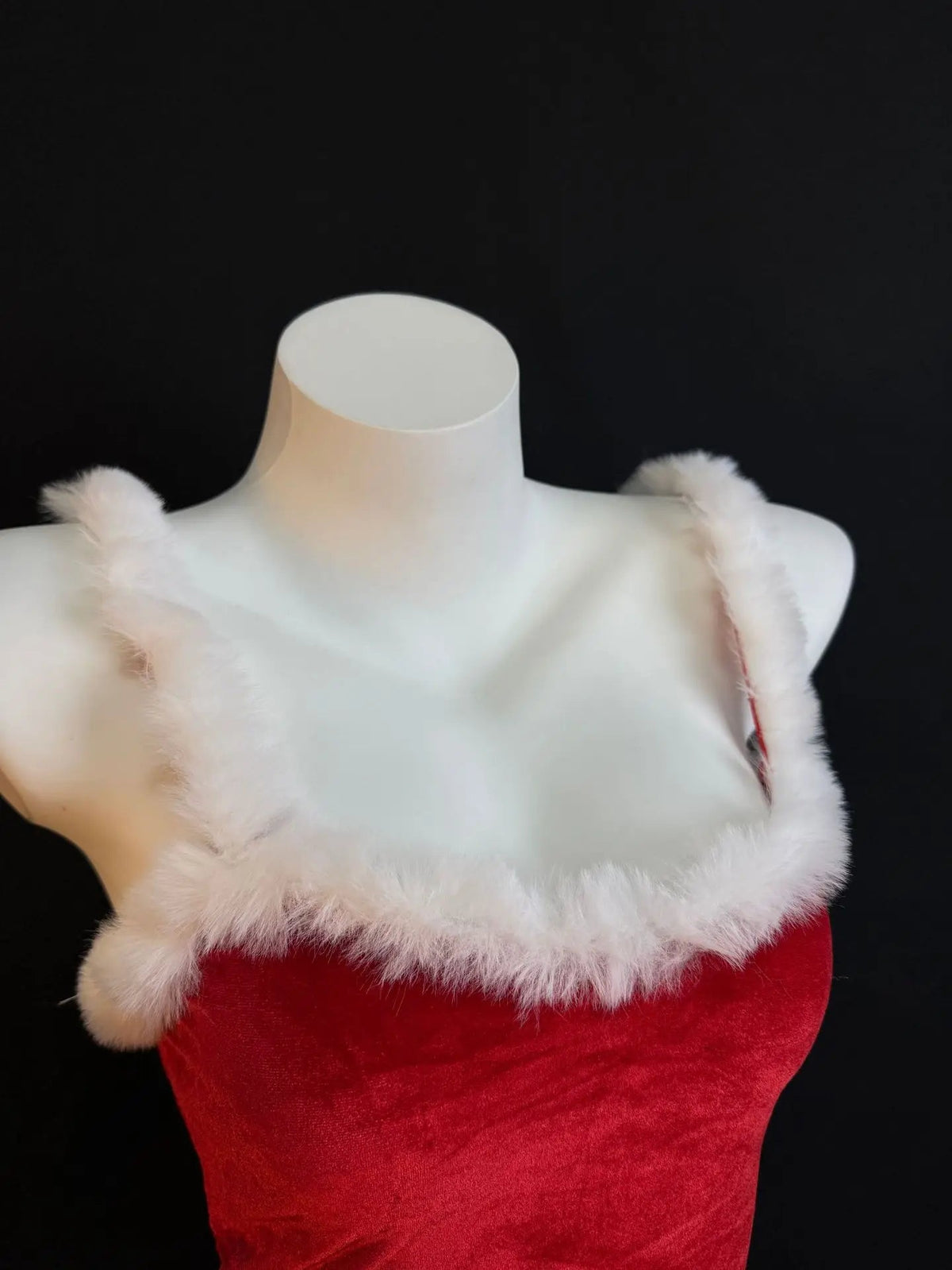 Women’s Christmas dress set by The Clothing Company Sydney featuring a sparkling red velvet fluffy dress and strap-up party costume.