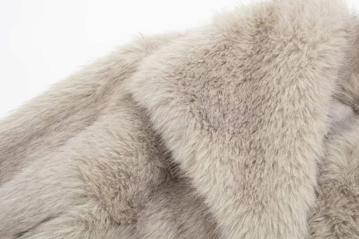 Women's faux fur cropped jacket from The Clothing Company Sydney, featuring long sleeves, snap buttons, lapel collar, and chic outerwear design.