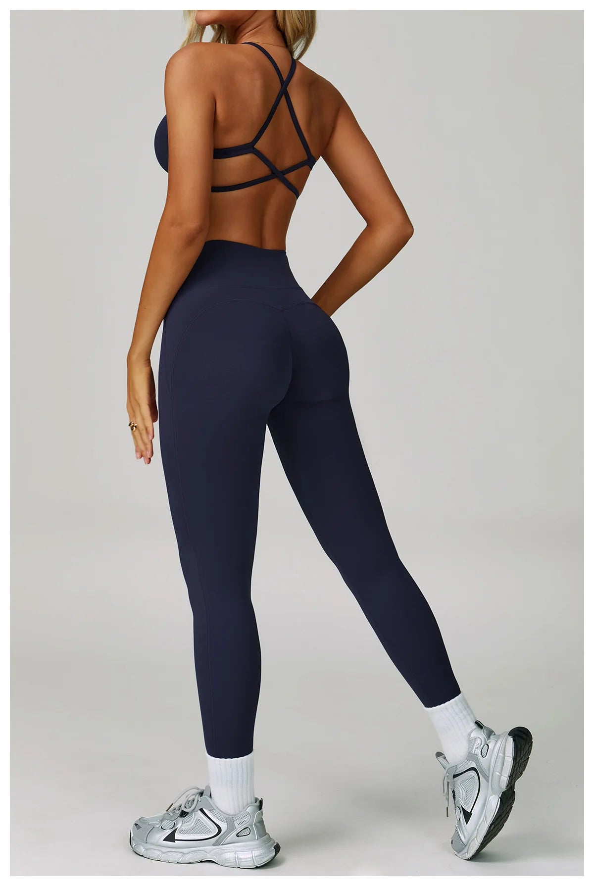 Women's fitness tracksuit set with high waist leggings and sports bra from The Clothing Company Sydney, ideal for yoga and workouts.