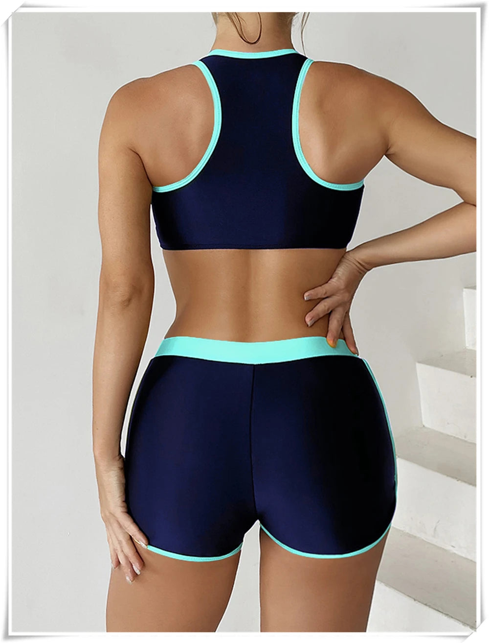 Two-piece swimsuit by The Clothing Company Sydney featuring a zipper tankini top and high-waist shorts for summer swimming and beachwear.