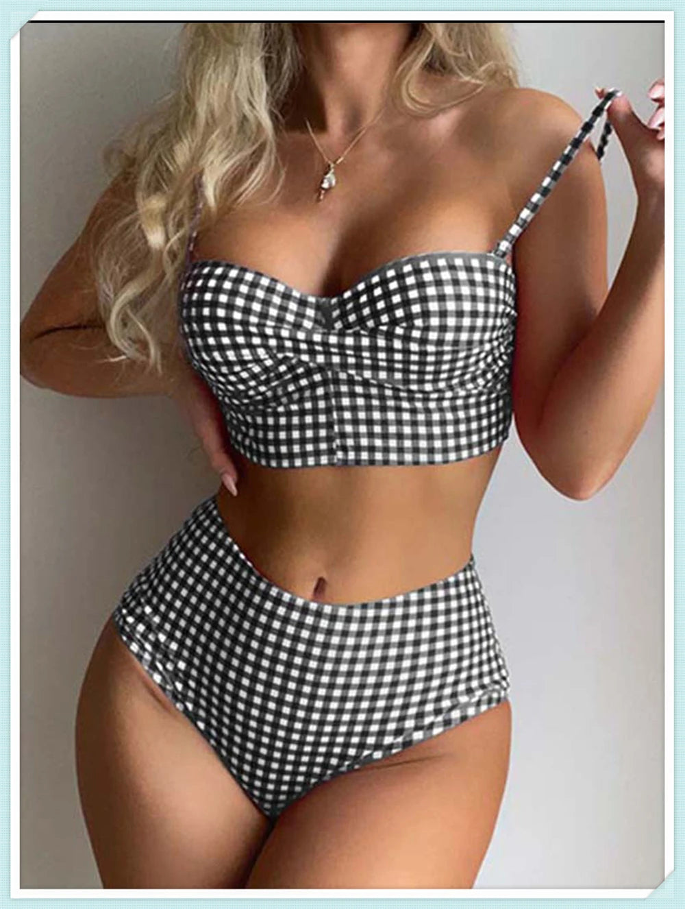 High waist printed swimsuit by The Clothing Company Sydney featuring straps, padding, and vibrant beachwear design.
