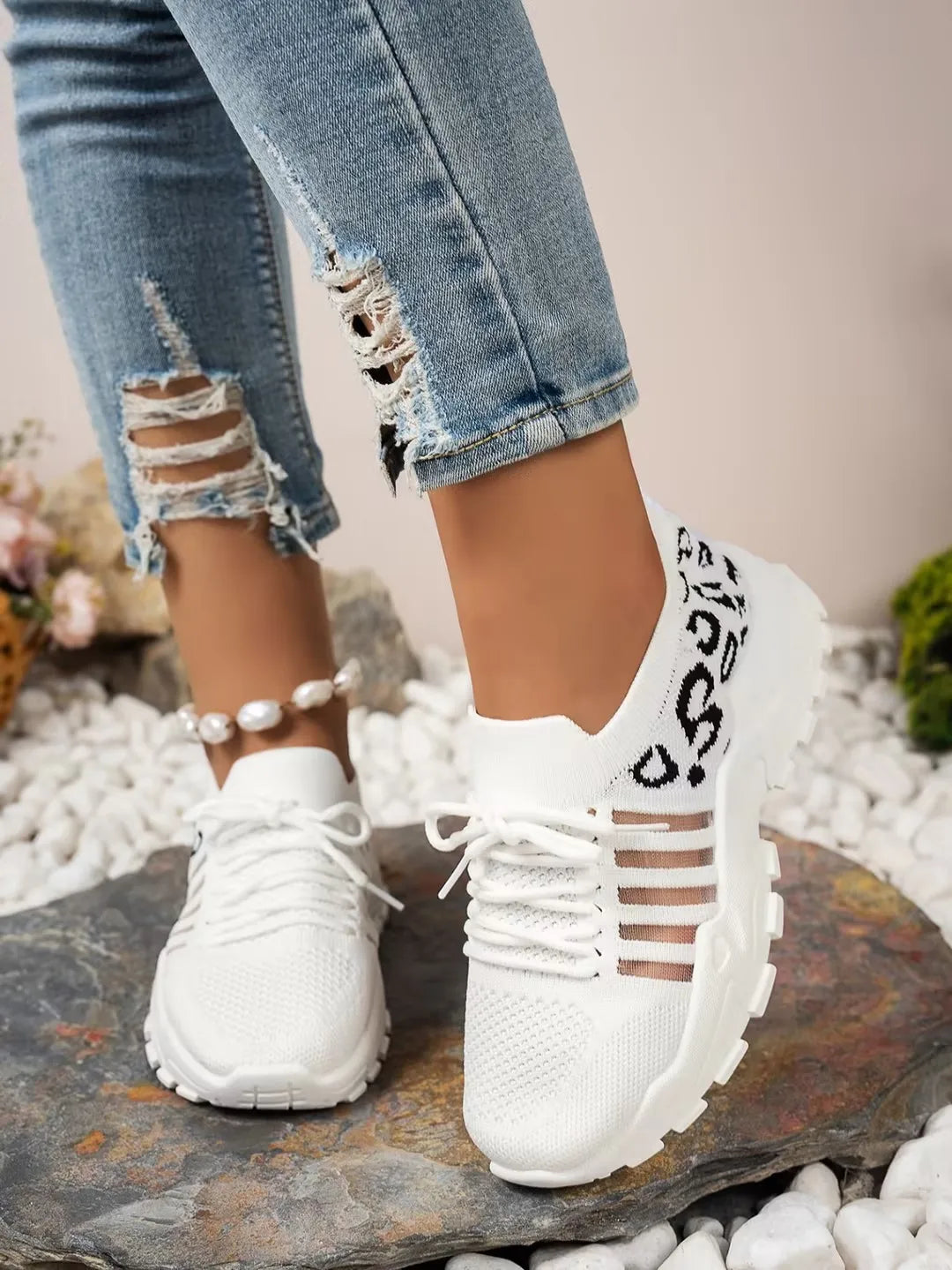 Leopard print women's waterproof sneakers from The Clothing Company Sydney, stylish footwear with a trendy animal pattern.