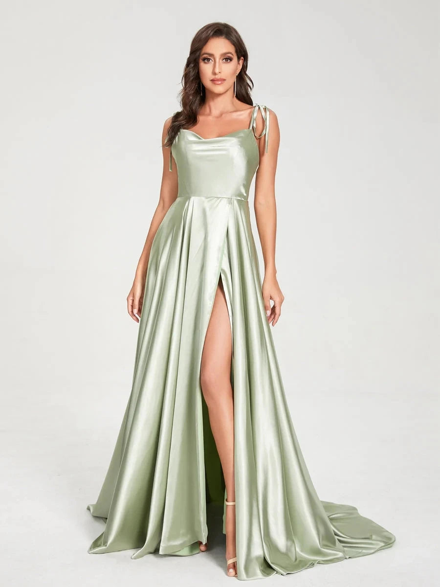 Mint green satin bridesmaid dress with side slit, backless design, spaghetti straps, perfect for summer evening weddings.