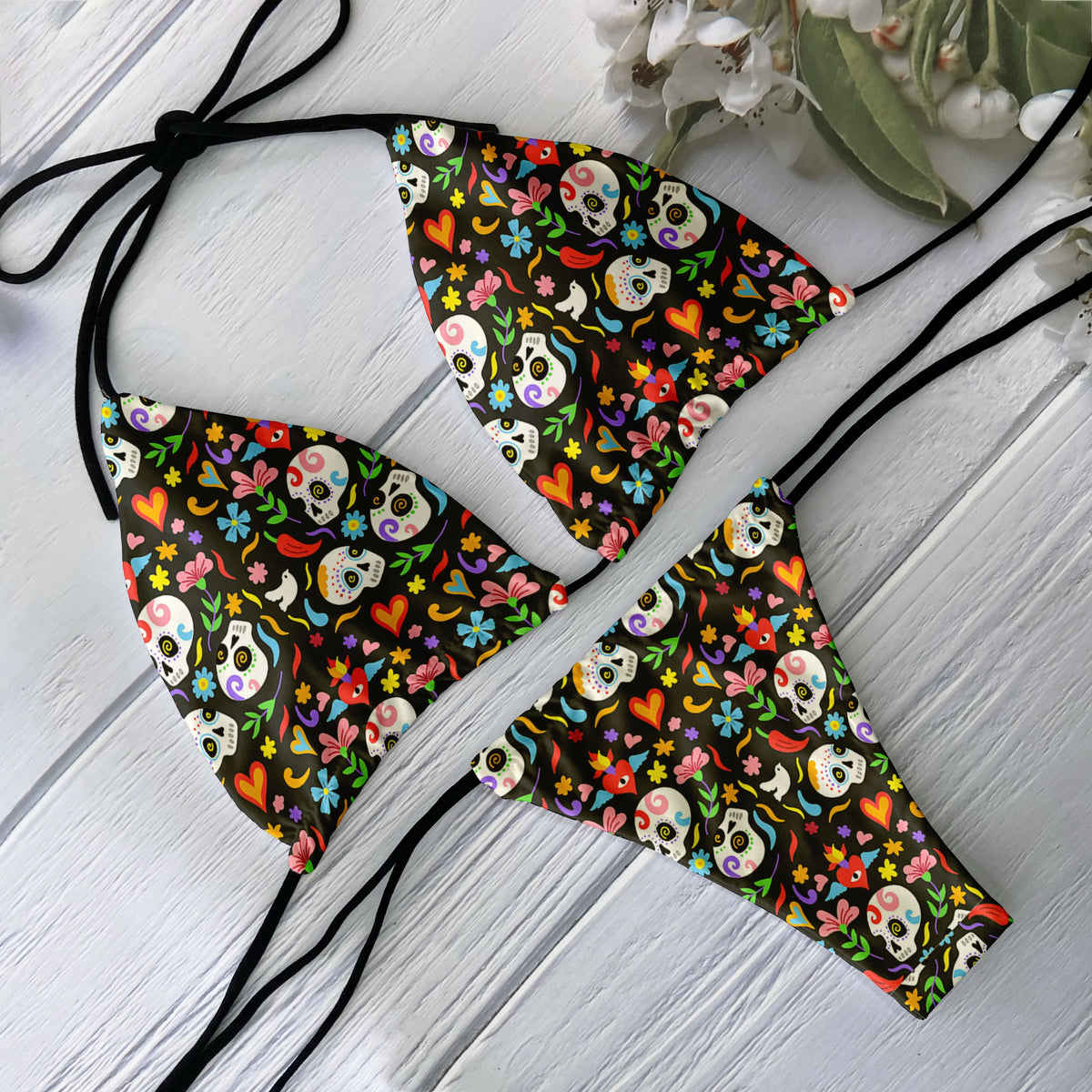 Women’s backless 2-piece bikini set with skull print, low waist, from The Clothing Company Sydney, perfect for beach and surfing.
