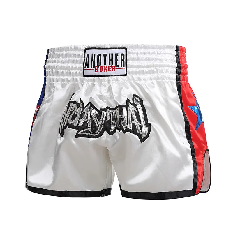 Embroidered Muay Thai boxing shorts with colorful stitching, made by The Clothing Company Sydney, displayed on a plain background.