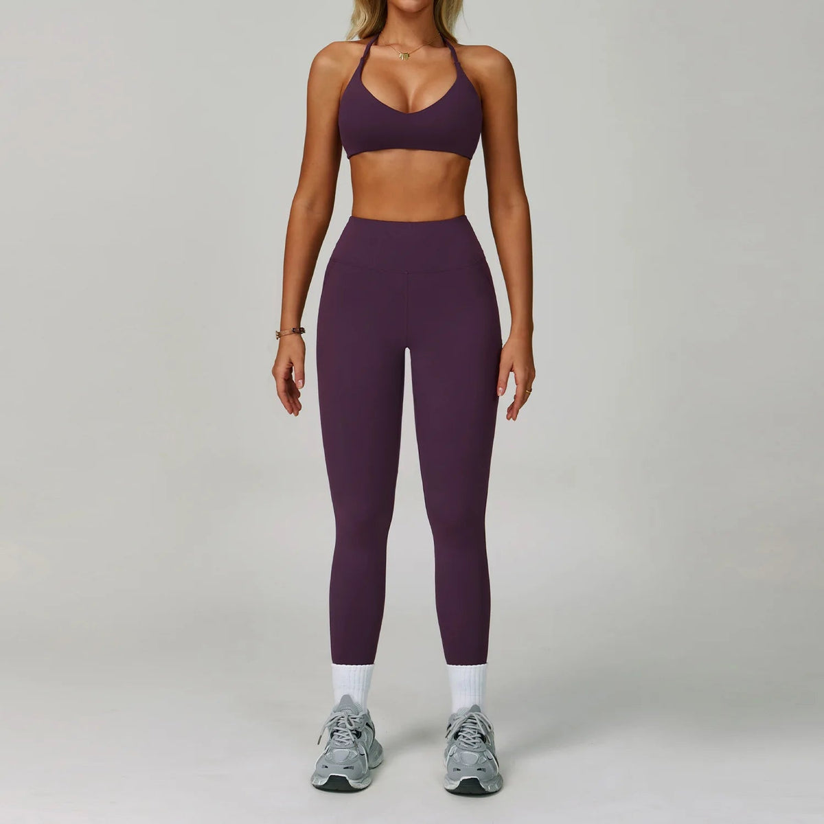 The Clothing Company Sydney women's 2-piece fitness tracksuit set with high waist leggings and sports bra for yoga and workout.