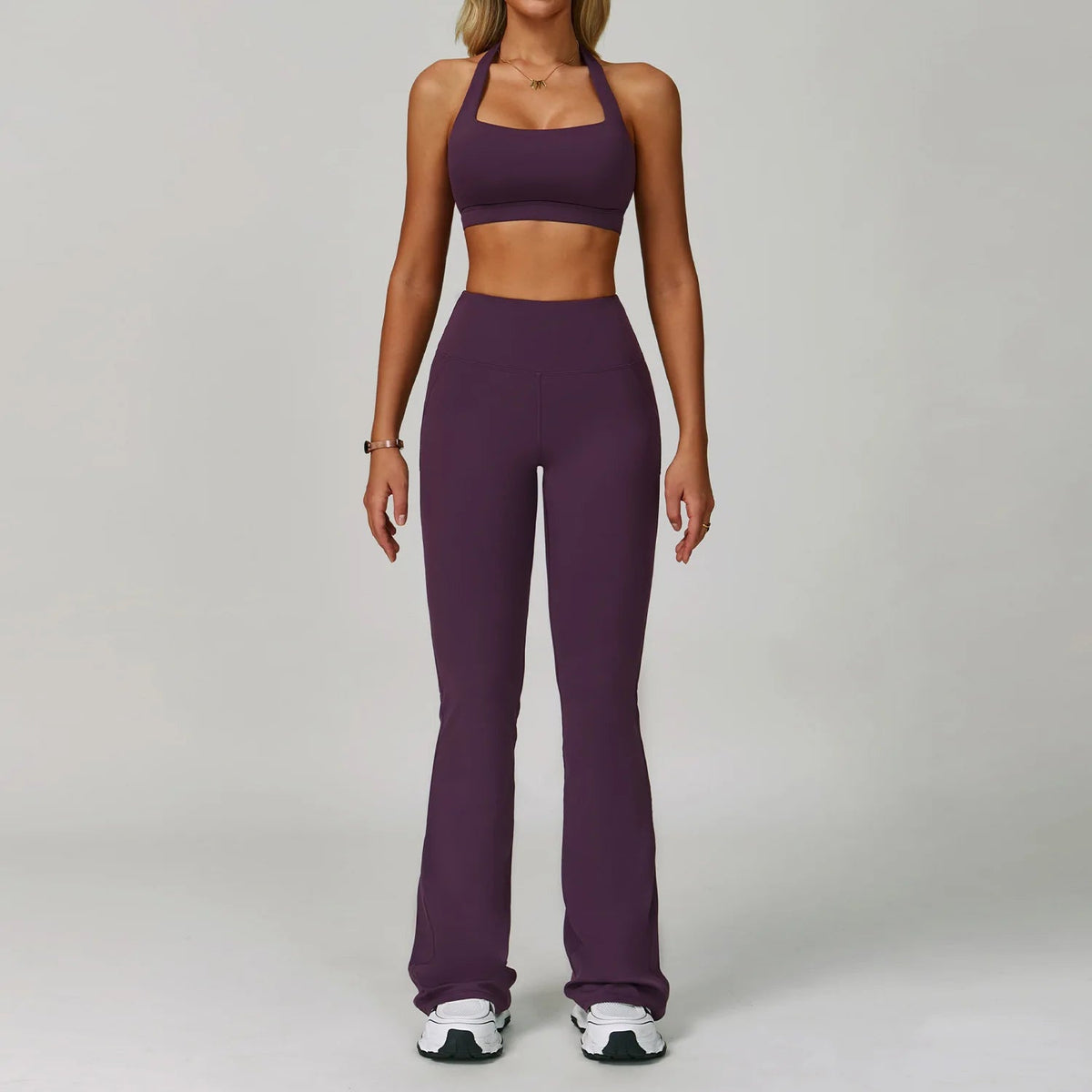 Two-piece women's fitness tracksuit with high-waist leggings and sports bra from The Clothing Company Sydney for yoga and workouts.