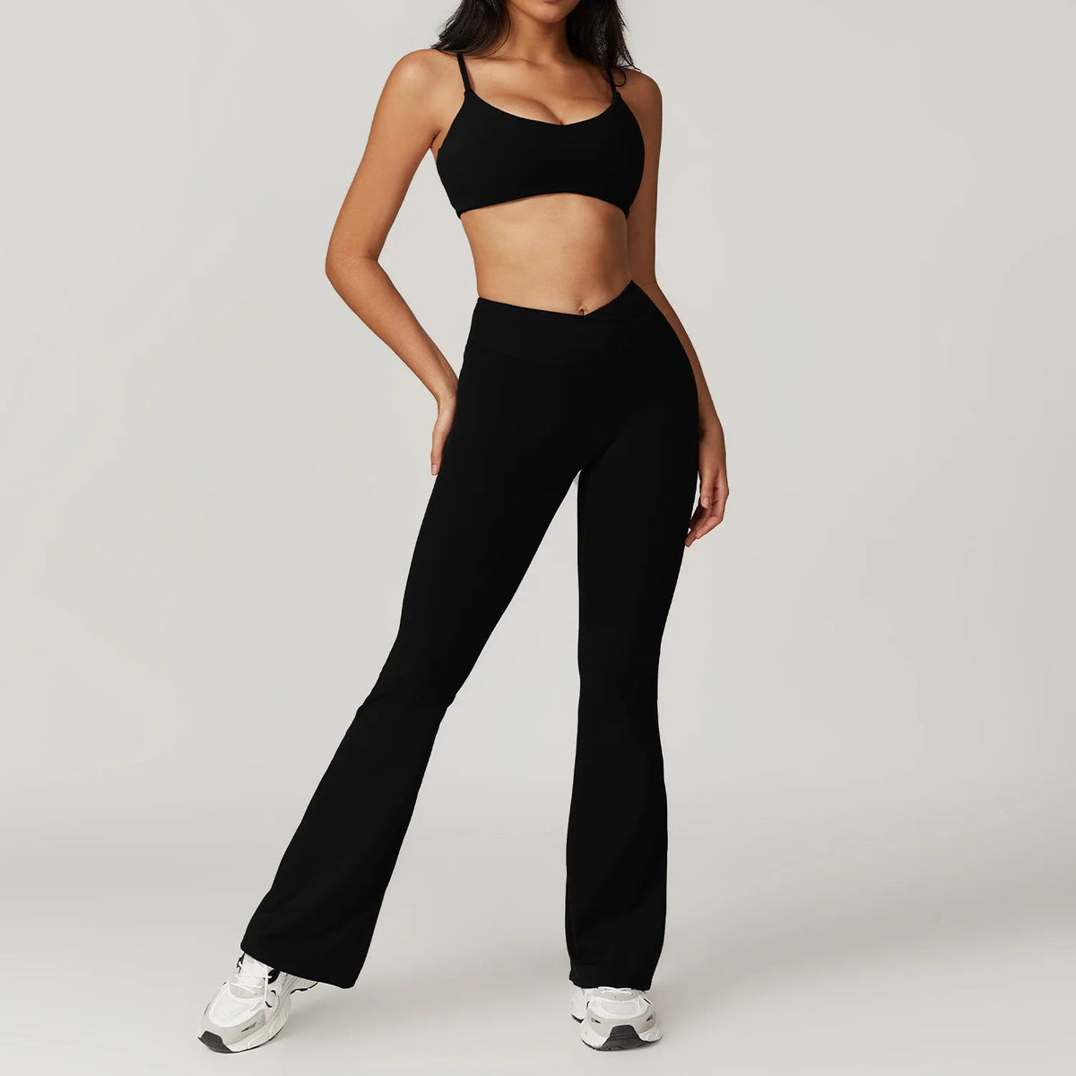 Two-piece women's fitness set including a crop top, sports bra, and gym leggings from The Clothing Company Sydney.