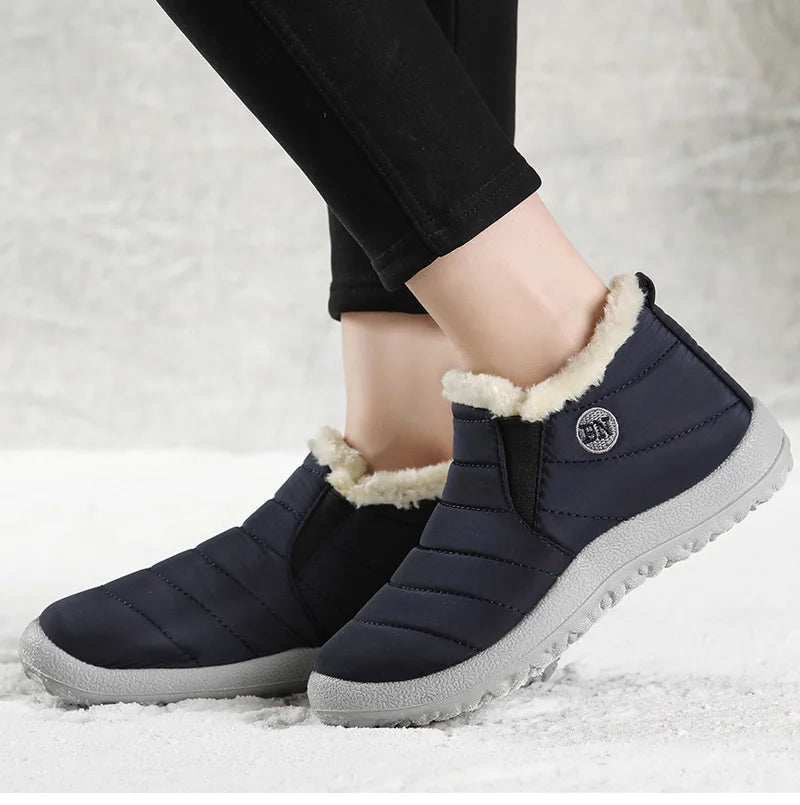 Men's winter ankle boots by The Clothing Company Sydney, waterproof slip-on snow shoes with fur lining and rugged sole detail.