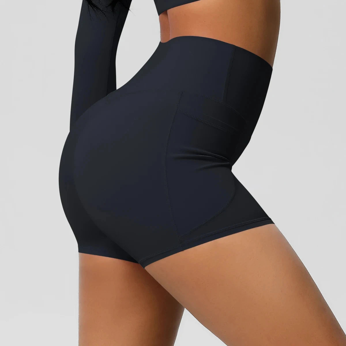 High-waisted bicycle yoga pants with pockets, quick-drying, breathable fabric, designed for women’s workout and fitness activities.