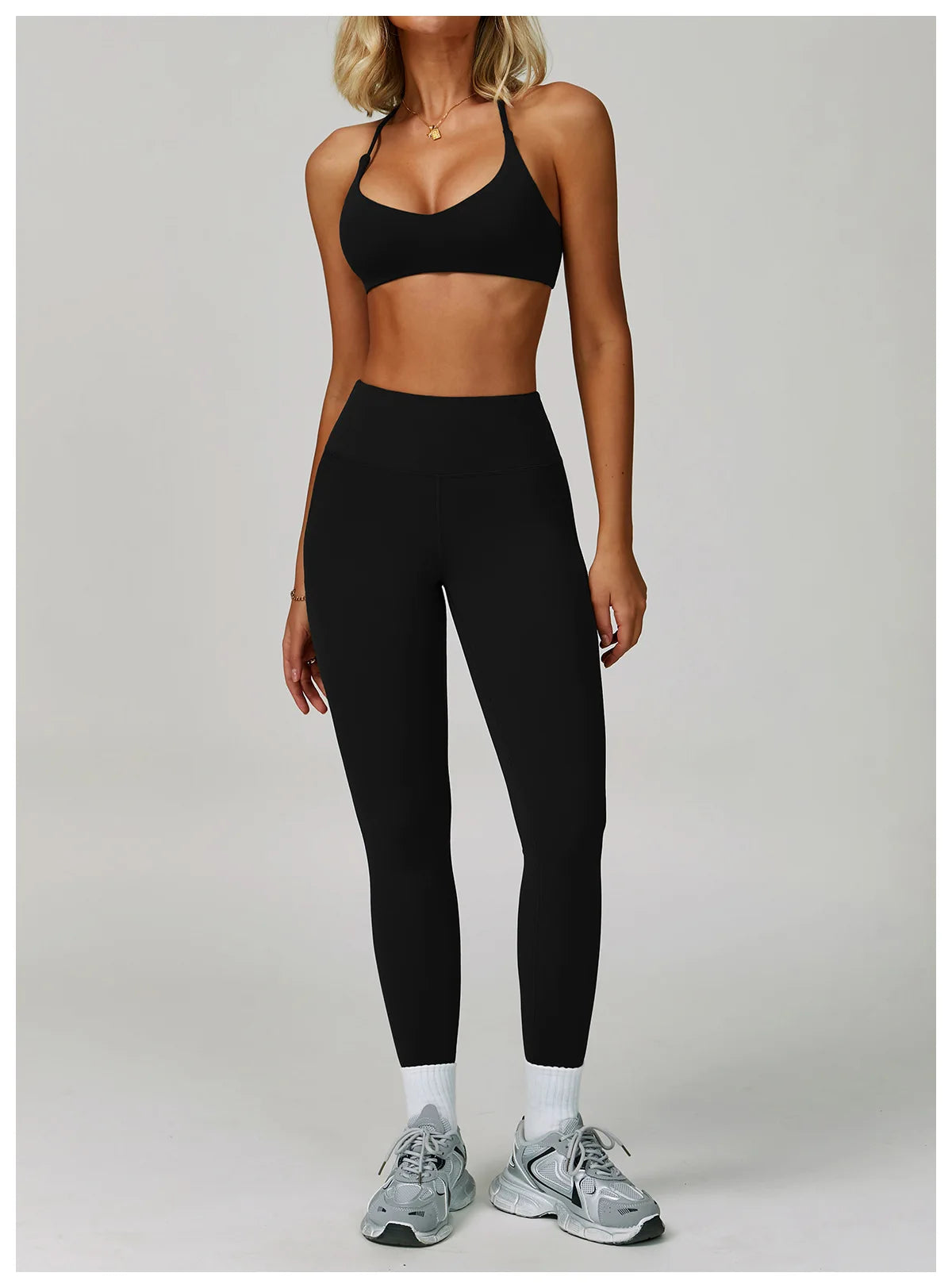 Women's fitness tracksuit set by The Clothing Company Sydney with high-waist leggings and workout sports bra for yoga and gym.