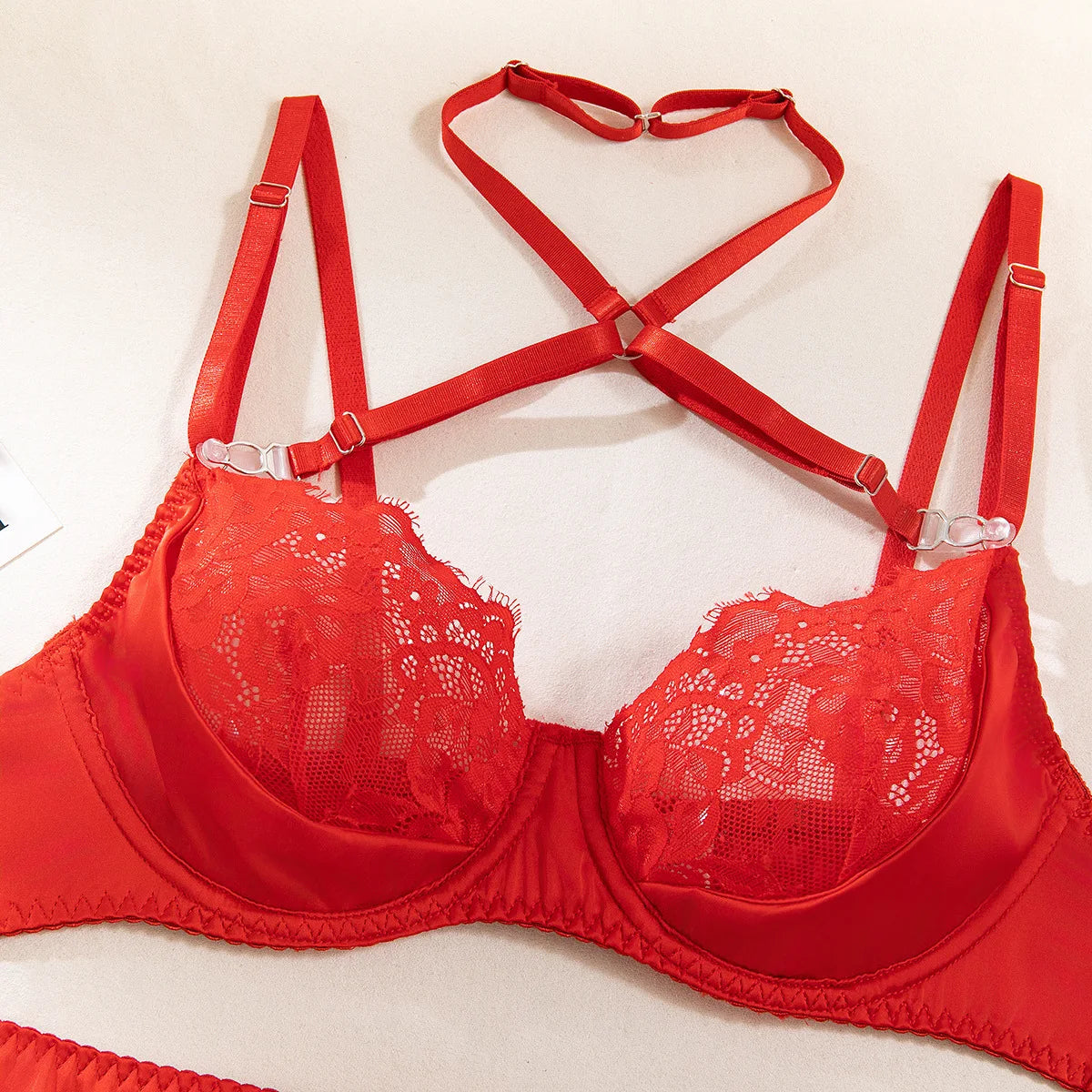 Lace lingerie set with halter bra, heart g-string, and garter belt, featuring intricate details and exotic style from The Clothing Company Sydney.