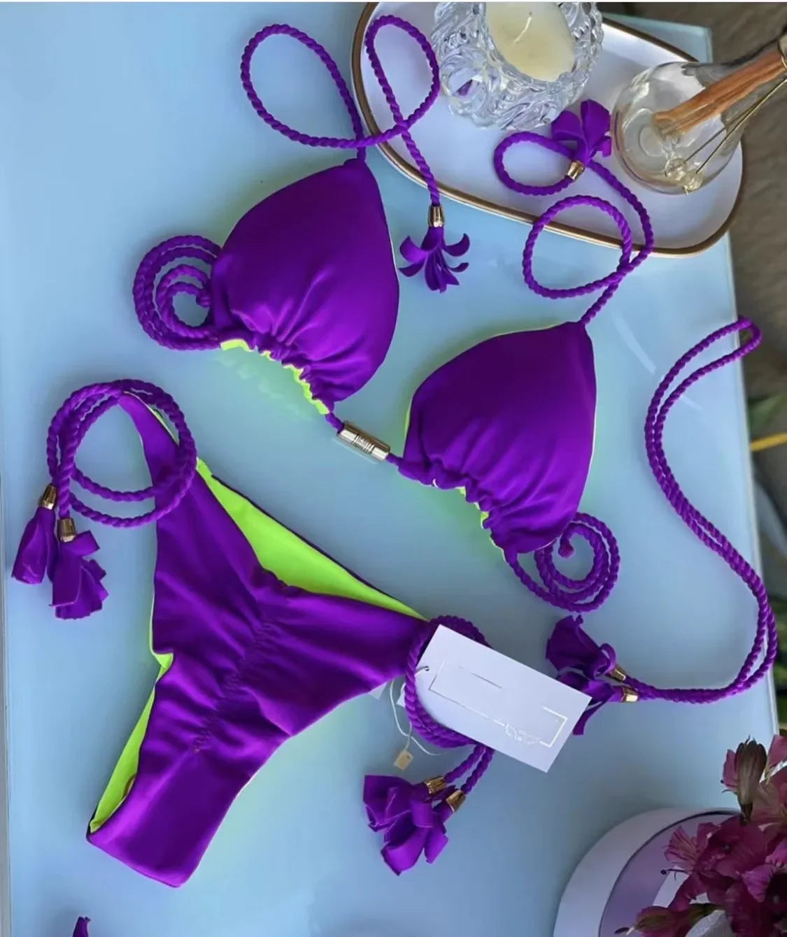 Backless women's bikini with rope triangle top and swimwear design from The Clothing Company Sydney, shown on a model.