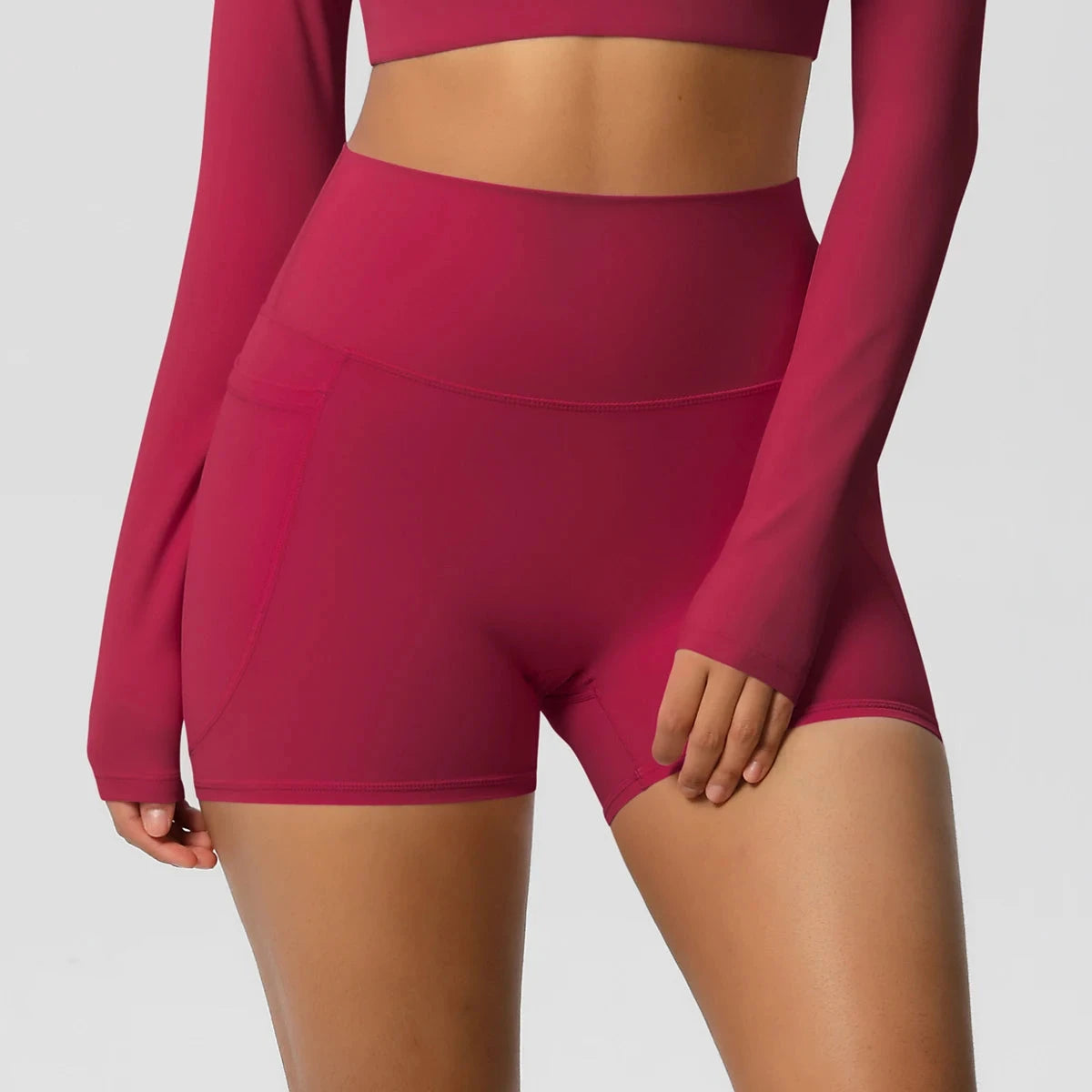 High-waisted bicycle yoga shorts by The Clothing Company Sydney with pockets, quick-drying, breathable fabric, and gym push-up fit.