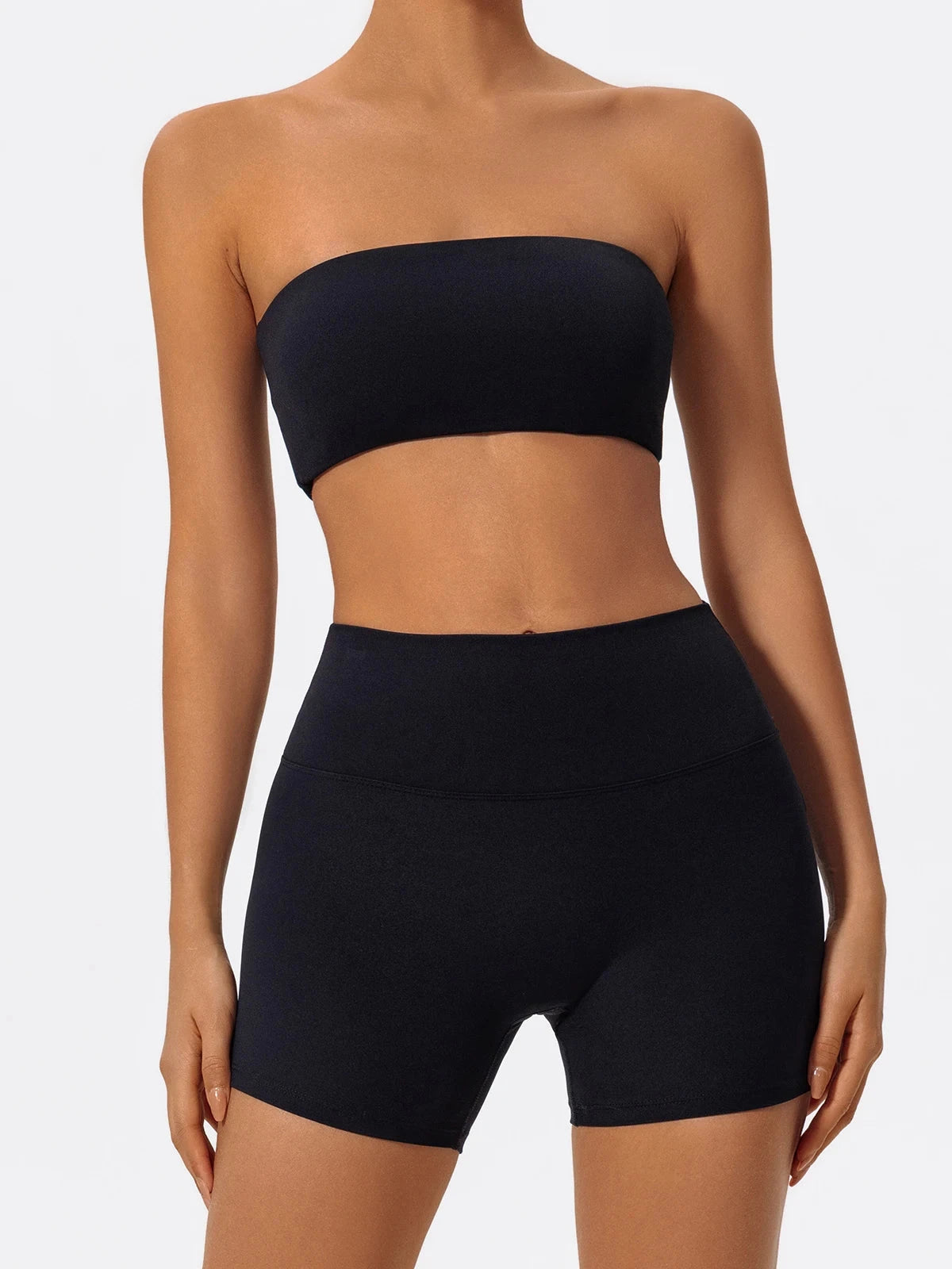 Two-piece women's fitness sports set featuring a strapless bra and gym crop top for workout and yoga activities.