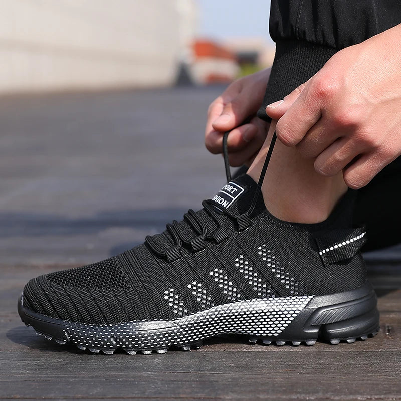 Men's casual sneakers by The Clothing Company Sydney with breathable mesh, lightweight construction, soft sole, slip-on design, and trainer style.