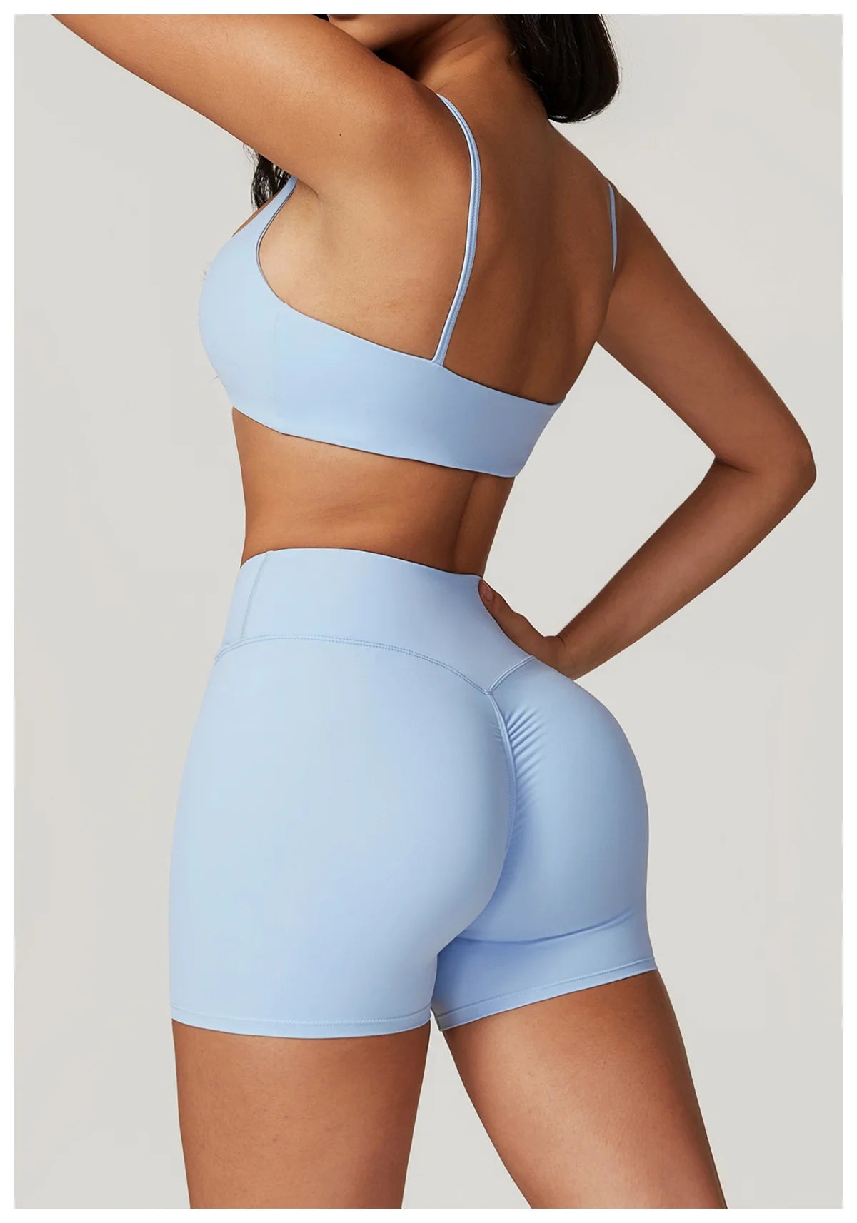 Two-piece women's yoga gym set with crop top, sports bra, and leggings from The Clothing Company Sydney for fitness and activewear.