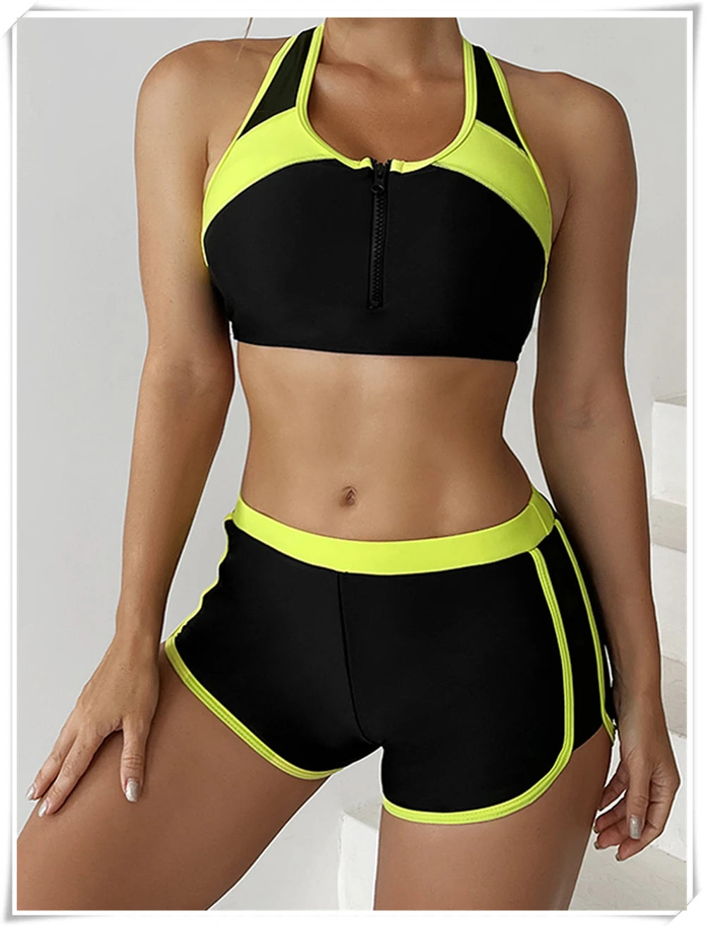 Two-piece swimsuit from The Clothing Company Sydney featuring a zipper tankini top and high-waist shorts for summer beachwear.