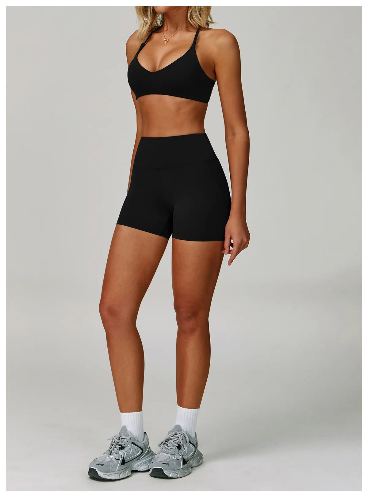 Two-piece women's fitness tracksuit from The Clothing Company Sydney, includes sports bra and high waist leggings for workout and yoga.