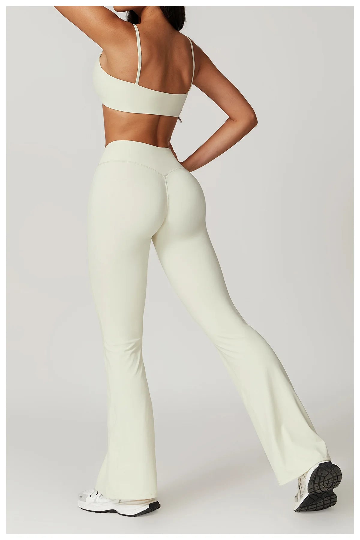 Two-piece women's fitness set including a short sleeve crop top, sports bra, and gym leggings from The Clothing Company Sydney.