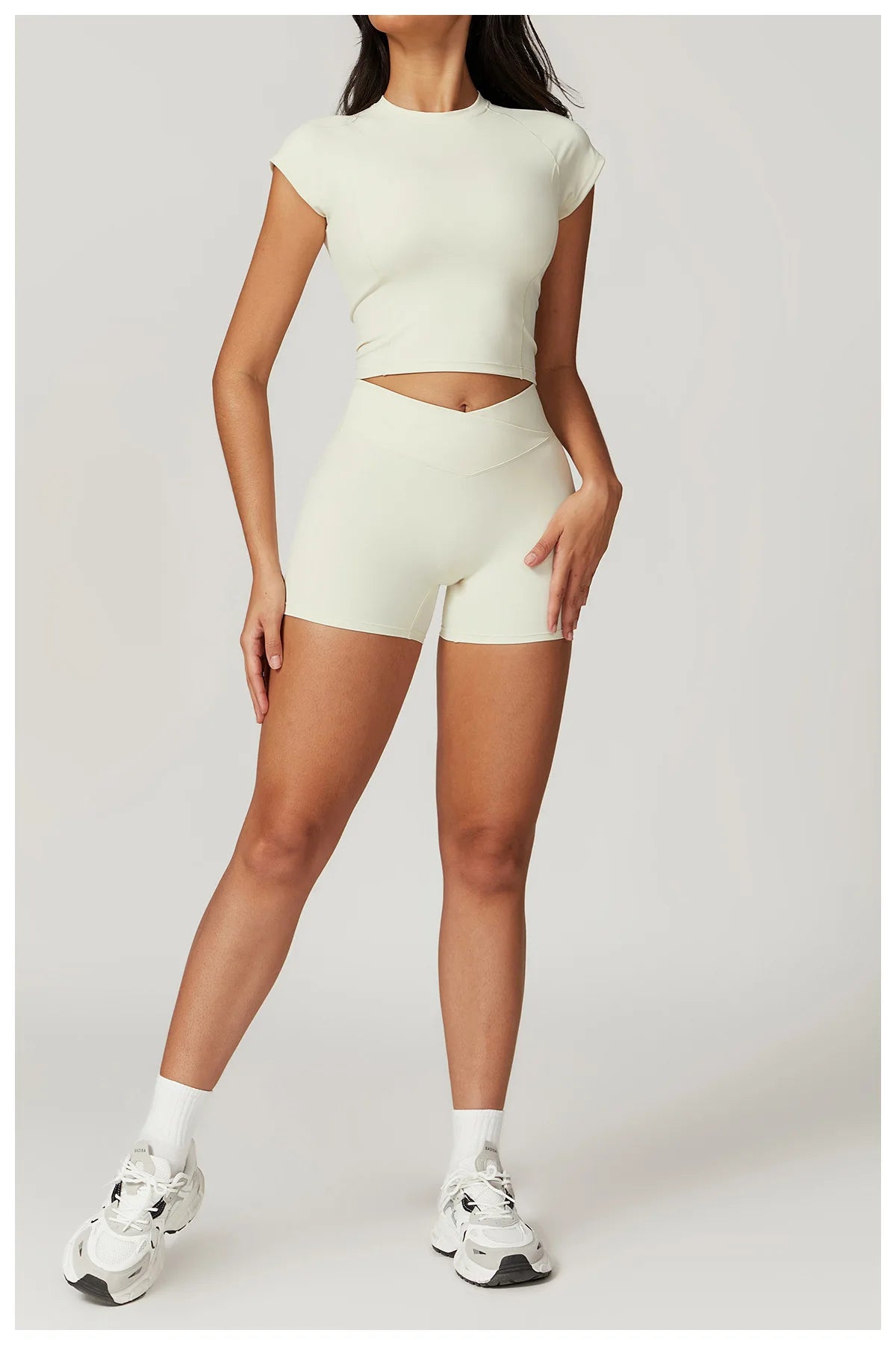 Two-piece women's fitness sportswear set including a crop top, sports bra, and leggings from The Clothing Company Sydney.