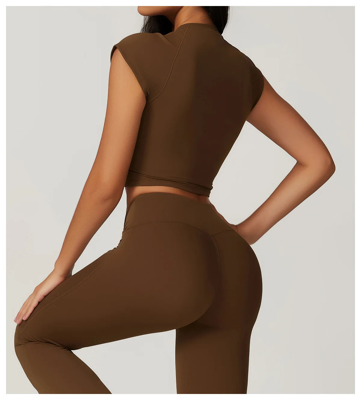 Two-piece women's fitness set including a short sleeve crop top, sports bra, and gym leggings by The Clothing Company Sydney.