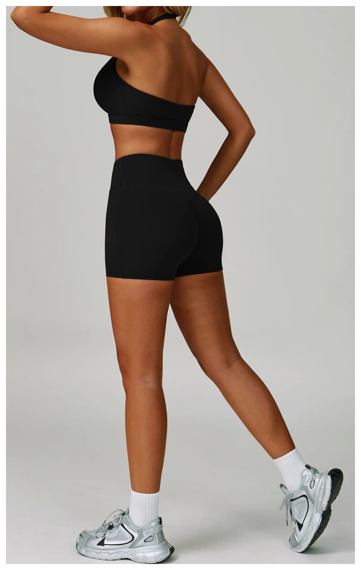 Two-piece women's fitness tracksuit including high-waist leggings and sports bra, perfect for yoga and gym workouts, from The Clothing Company Sydney.