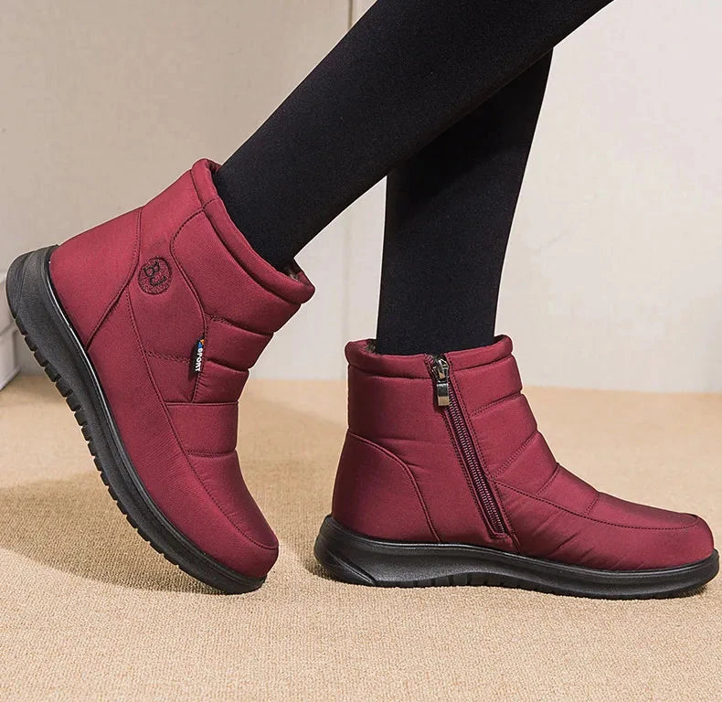 Women’s ankle snow boots with low heels and flat shoes in winter, featuring waterproof material and cozy lining from The Clothing Company Sydney.