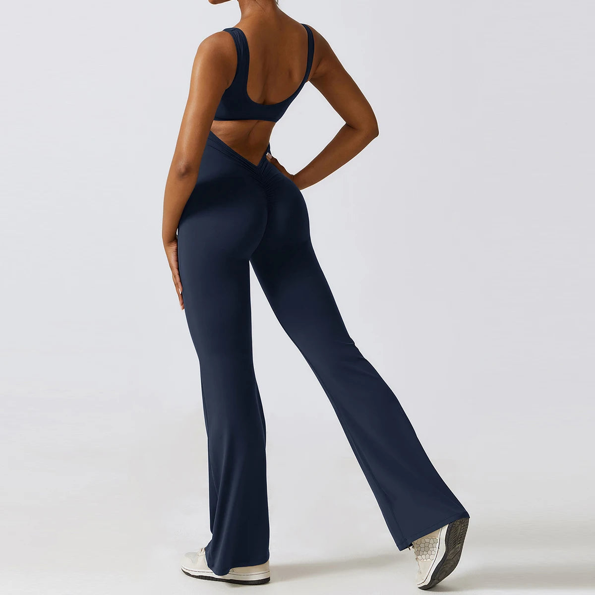 Open back V jumpsuit gym set for women, stylish fitness sportswear from The Clothing Company Sydney, perfect for yoga and workout sessions.