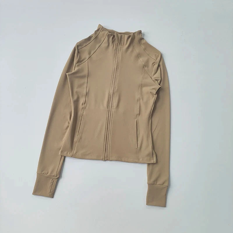 Women’s slim-fit fitness jacket by The Clothing Company Sydney, long sleeve zip-up yoga and workout top for running and gym activities.