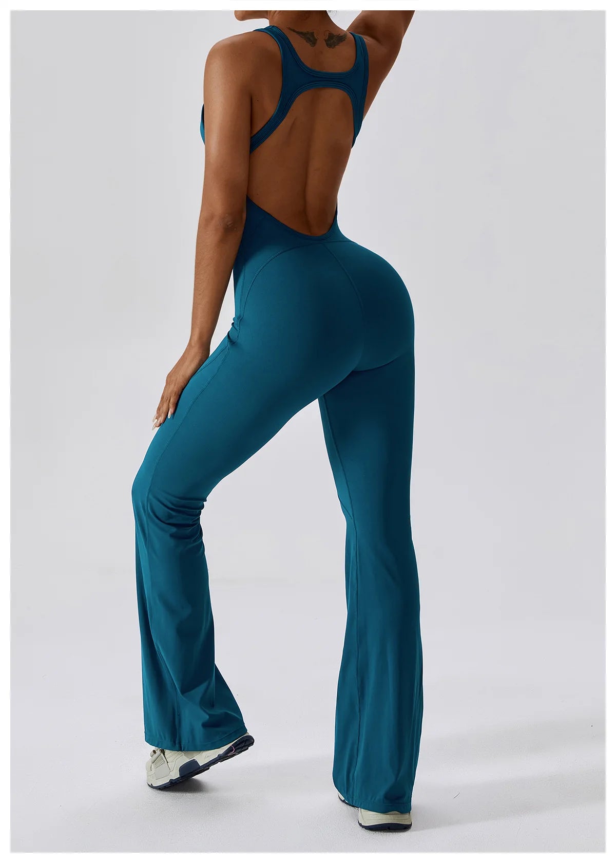 Open back V-neck fitness jumpsuit by The Clothing Company Sydney, featuring stretch fabric and tailored for yoga, gym, and workout activities.