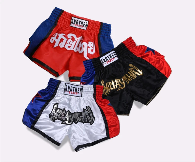 Embroidered Muay Thai boxing shorts with intricate design by The Clothing Company Sydney, featuring vibrant fabric and detailed stitching.