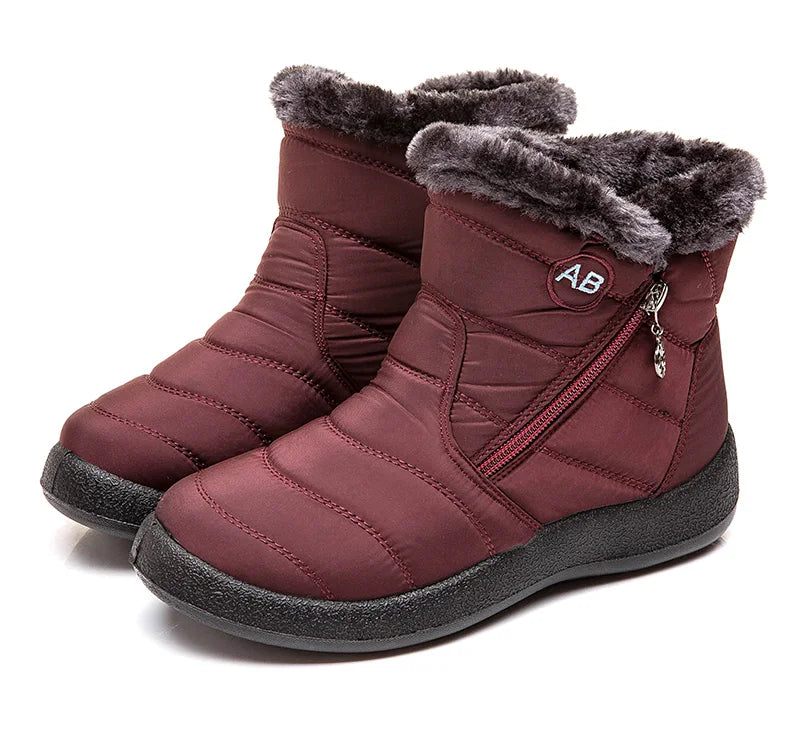 Women's winter ankle boots with low heels and snow-resistant design by The Clothing Company Sydney, showcasing stylish winter footwear.