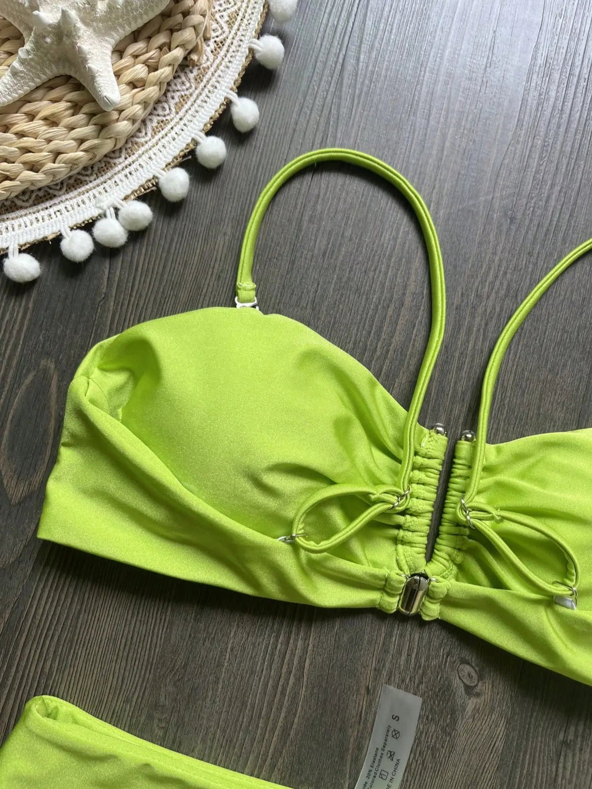 Two-piece bandeau bikini set with push-up design, solid color, Brazilian style swimwear, featuring thong bottoms and beachwear look.