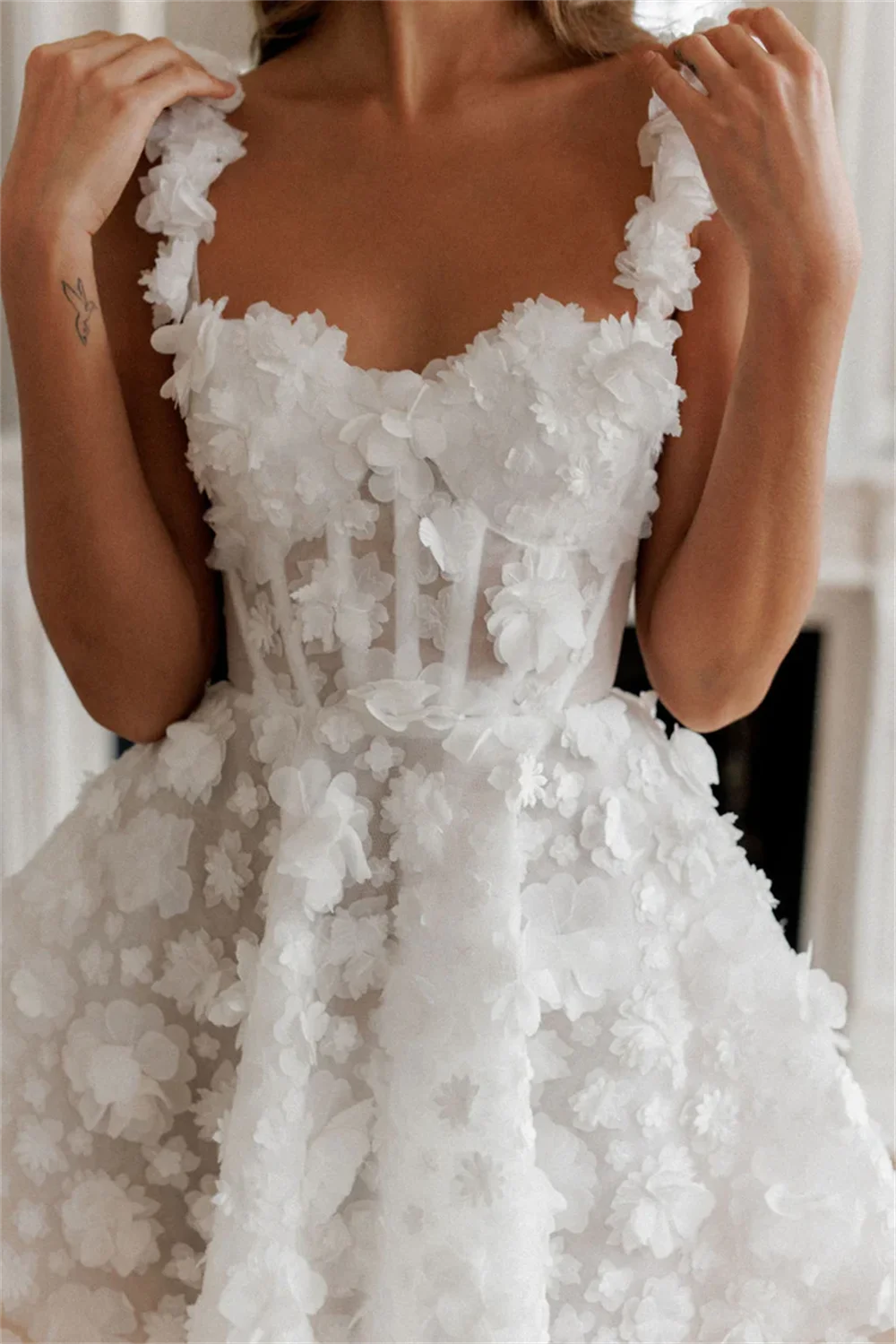 White mini prom dress with flower lace embroidery, sleeveless design, spaghetti straps, and lace-up back by The Clothing Company Sydney.