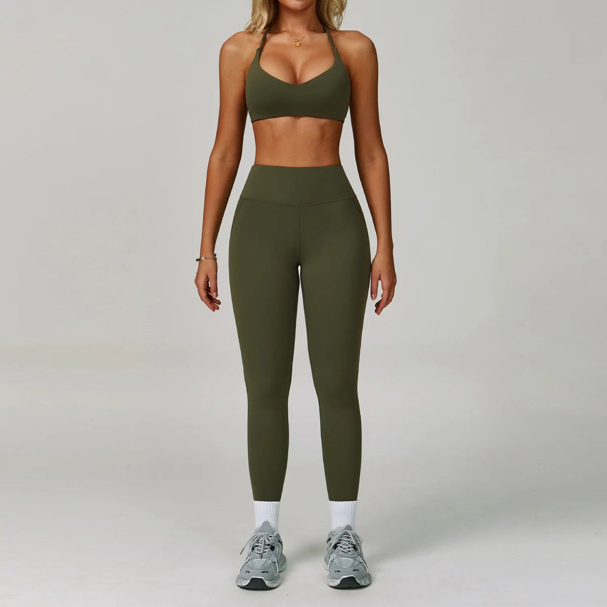 Two-piece women's fitness tracksuit set by The Clothing Company Sydney, includes high-waist leggings and sports bra for workout and yoga.