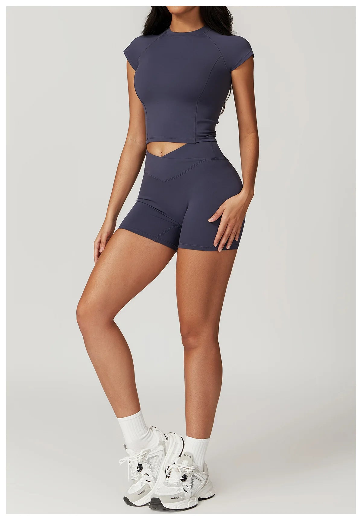 Two-piece women's fitness sportswear set including a short sleeve crop top, sports bra, and gym leggings from The Clothing Company Sydney.