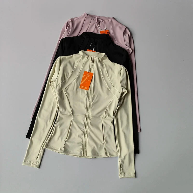 Women’s slim fit fitness jacket by The Clothing Company Sydney, long sleeve zip-up activewear top for yoga, running, and gym workouts.
