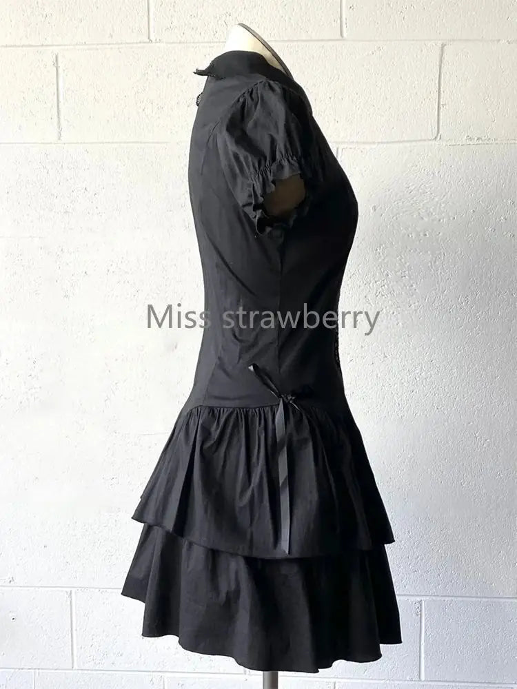 Black vintage Gothic dress with short sleeves, patchwork design, slim fit, high street Y2K style, by The Clothing Company Sydney.