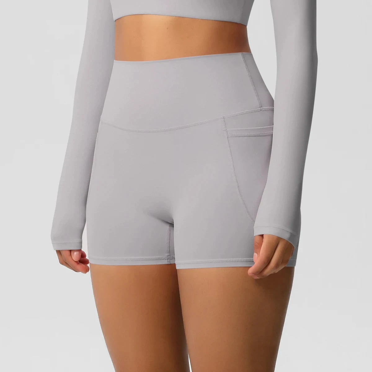 High-waisted bicycle yoga shorts from The Clothing Company Sydney with pockets, quick-drying, breathable fabric, ideal for workout and fitness.