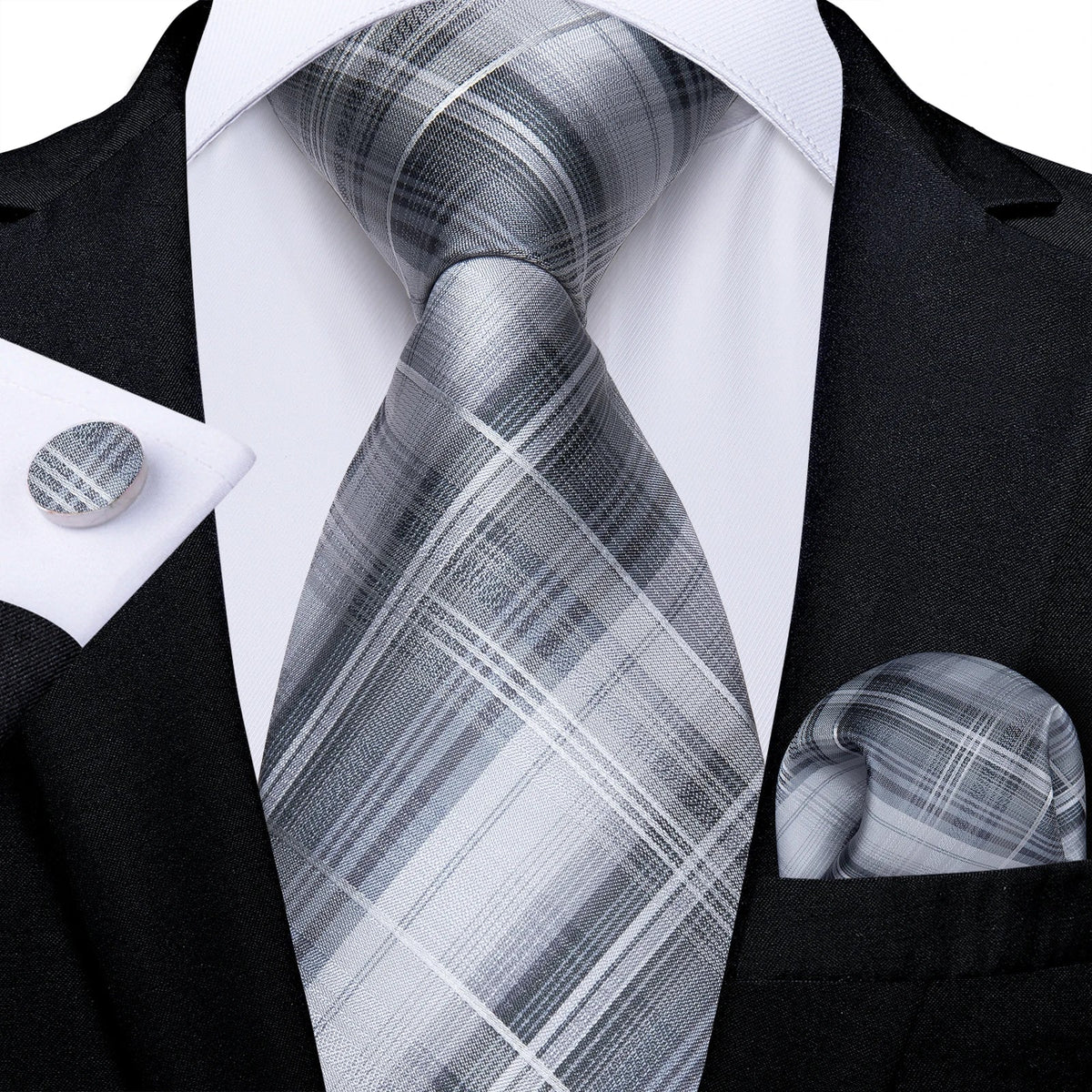 Men's gray paisley silk tie set including wedding tie, pocket square, and cufflinks with intricate paisley pattern.