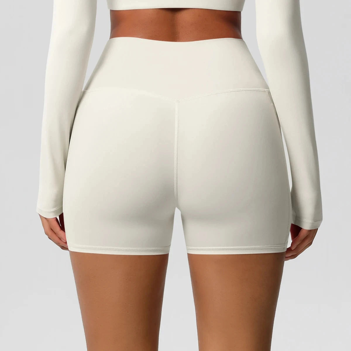 High-waisted bicycle yoga pants with pockets from The Clothing Company Sydney, quick-drying, breathable gym shorts for women.