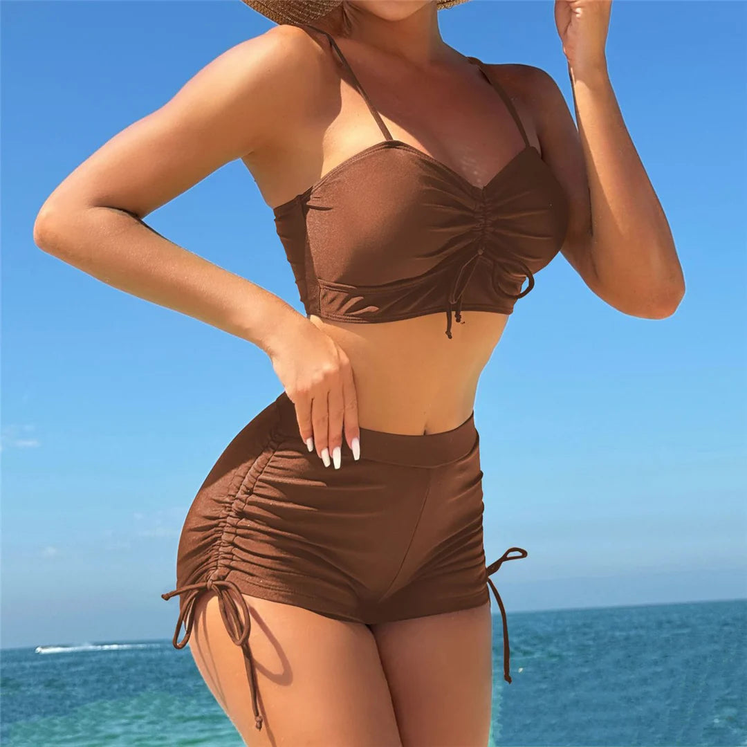 High-waist knotted bikini set by The Clothing Company Sydney, featuring wrinkled fabric and two-piece swimwear for women.