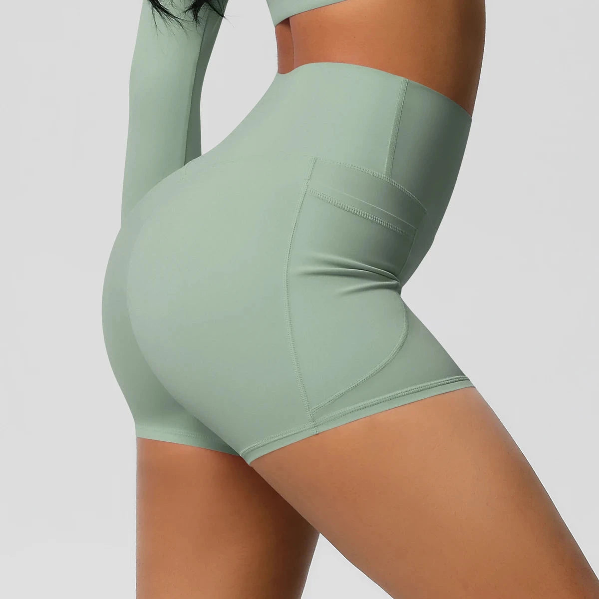 High-waisted bicycle yoga shorts with pockets, quick-drying breathable fabric, and gym push-up design for women’s workout fitness.