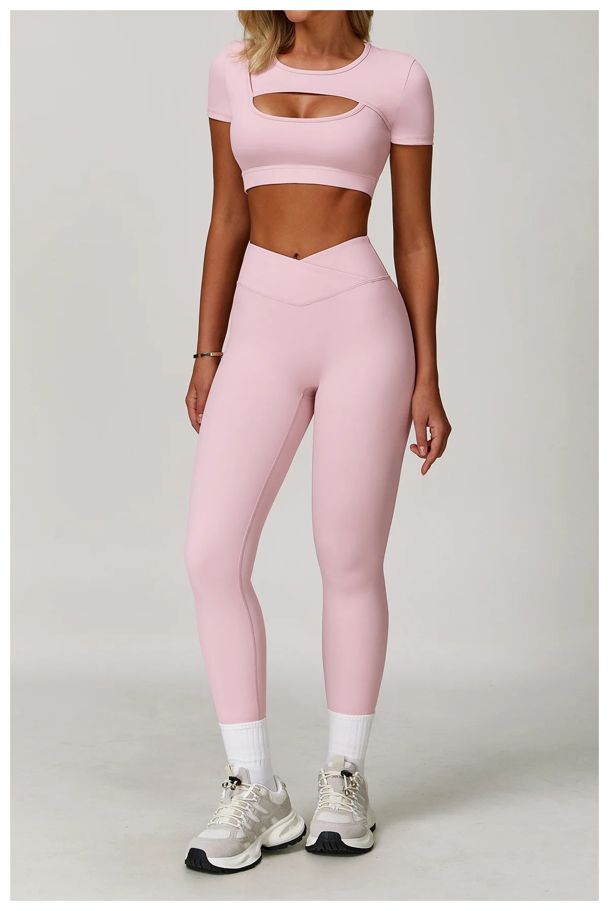 Pair of women's fitness yoga gym clothes from The Clothing Company Sydney, featuring sports bra and matching leggings for workout and running.