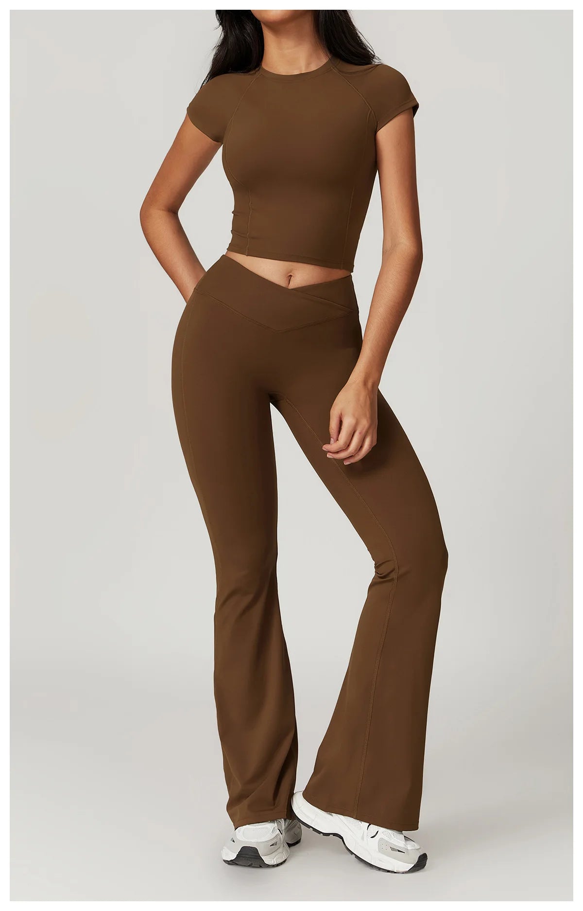 Two-piece women's fitness set including a crop top, sports bra, and leggings from The Clothing Company Sydney for yoga and gym workouts.