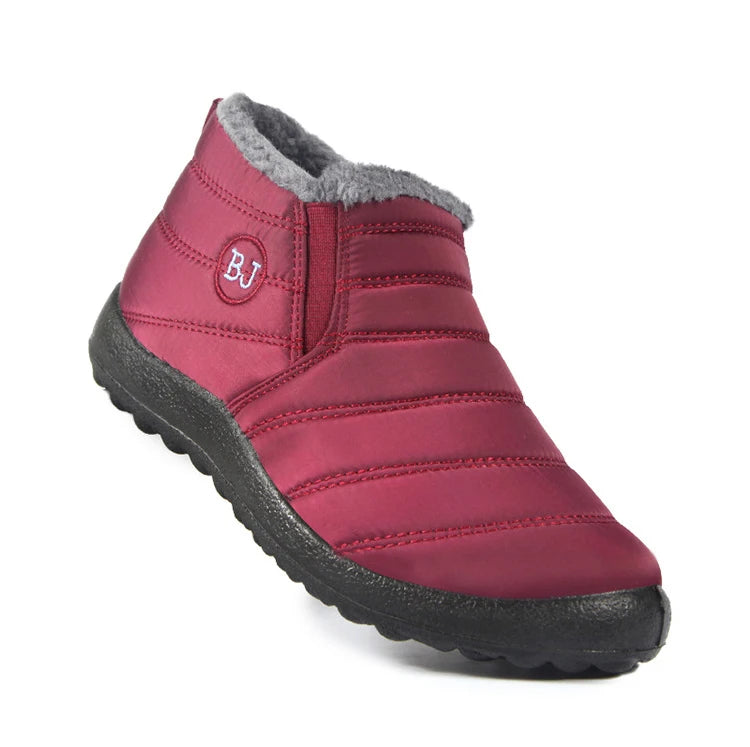 Women’s waterproof fur snow boots by The Clothing Company Sydney, slip-on ankle footwear with cozy fur lining for winter warmth.
